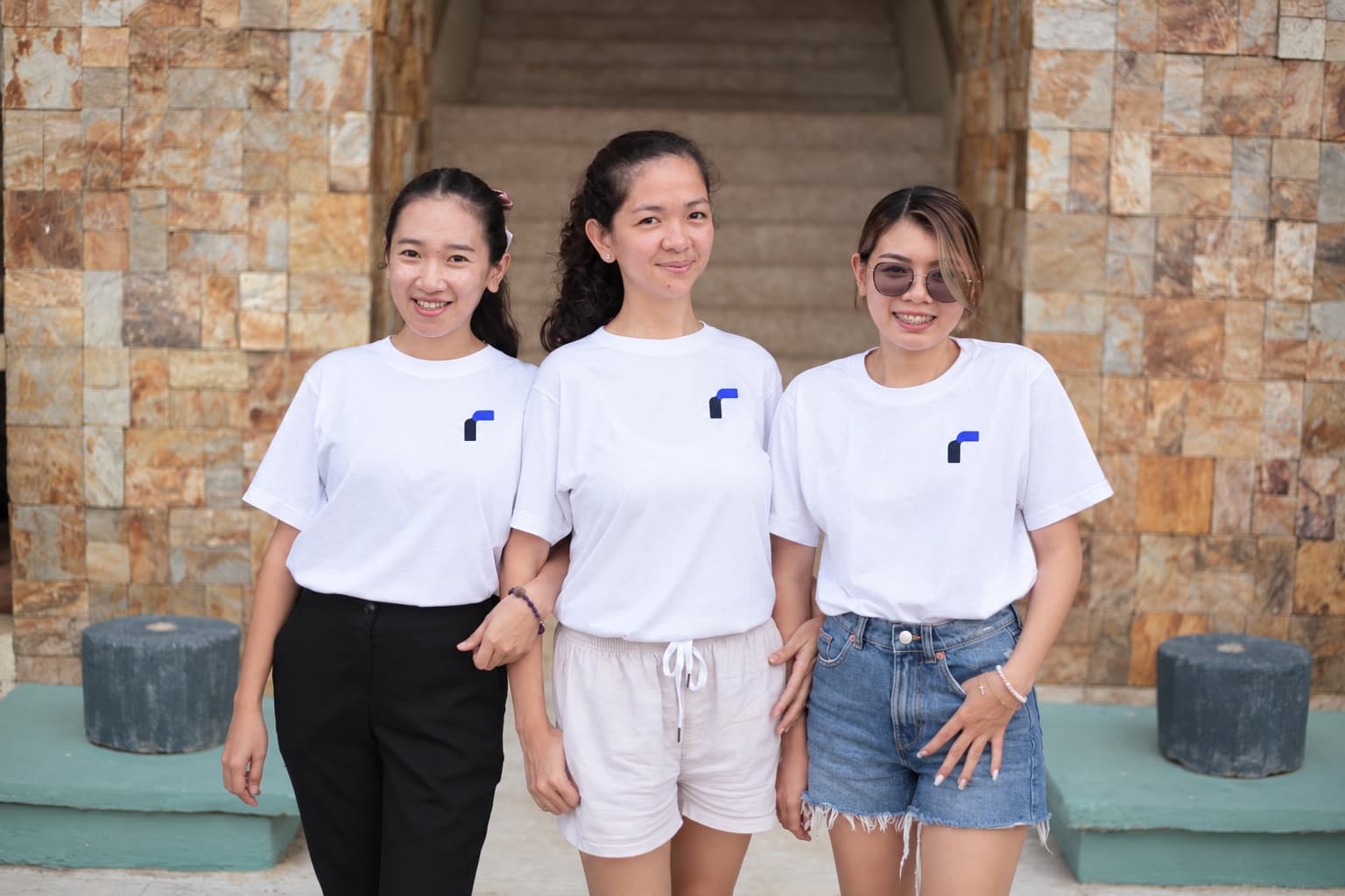 Three members of the Ramp Remote team in the Philippines, in Ramp Remote T-shirts