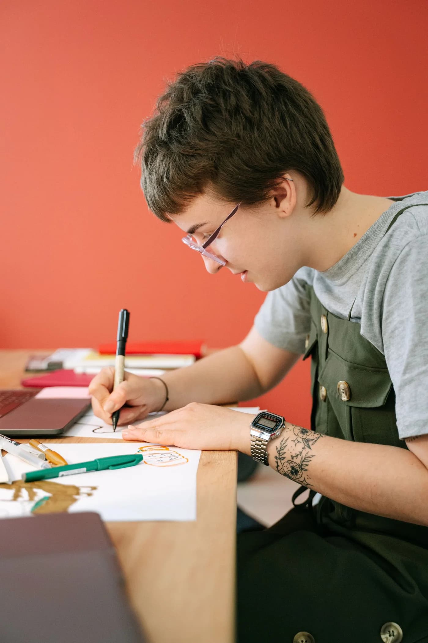 A designer sketching at a desk.