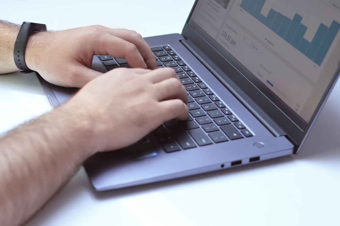A professional examining website analytics on a laptop.