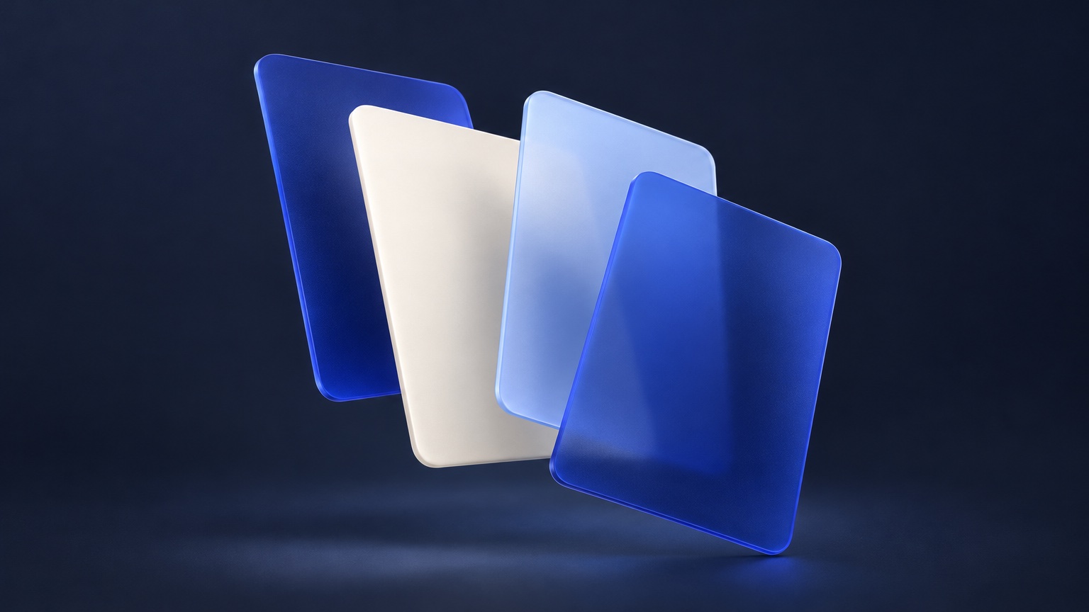 Four frosted cobalt, ivory and pale blue panels fanned out like blank artboards.